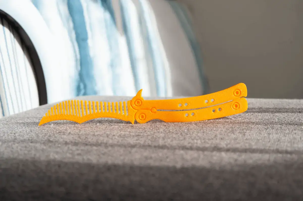 Butterfly knife comb
